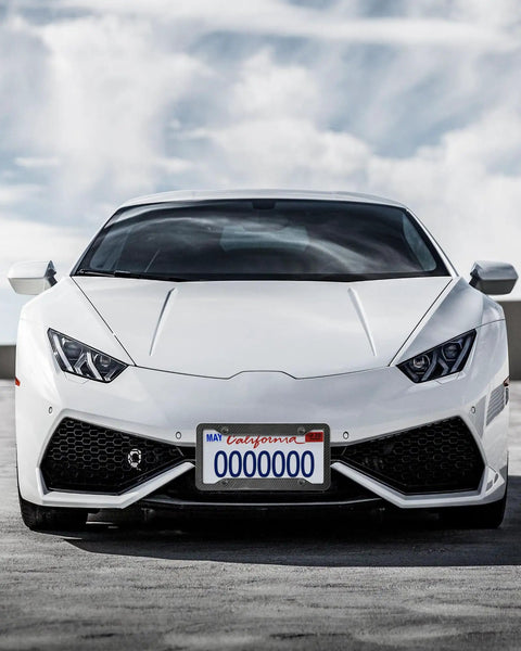 Front view of white sports car with Carbon Fiber Pattern License Plate Frames 2 Pack Black Aluminum Front And Rear Car Tag Holder