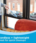 Person using Cordless Handheld Vacuum With Wall Mount Base And Charger Bagless Dust Bowl Lightweight 2Ah Lithium Ion Power.