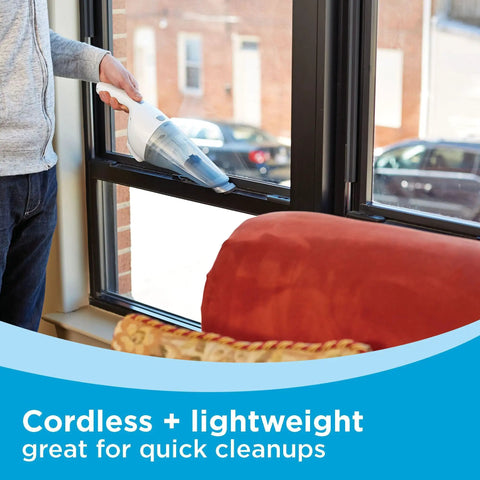 Person using Cordless Handheld Vacuum With Wall Mount Base And Charger Bagless Dust Bowl Lightweight 2Ah Lithium Ion Power.