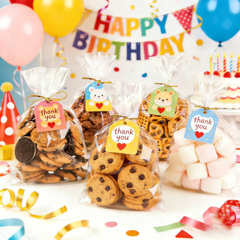 Clear Cellophane Treat Bags 200 Pack 6X10 Inch With Gold Twist Ties For Cookies Candy Birthday Party Favors Graduation And Homemade Bakery Packaging Must Have Bulk Value Pack Food Grade Small Candy Bags showcasing cookies and marshmallows