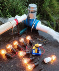 Portable 1000W 110V Water Turbine Generator For Home And Camping Off Grid Ready in use powering light bulbs outdoors