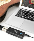 Guitar Audio Interface for iPhone iPad Mac PC with 24 Bit 96 Kilohertz Recording USB C Lightning and USB Cables connected to laptop