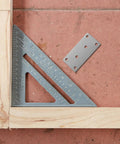 Stainless Steel Corner Desk Connector Brace Pack Of 10 For Wood Furniture with a ruler and wooden frame on tiled surface