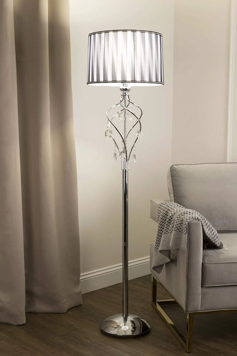 63 Inch Lady Crystal Floor Lamp With Twisted Metal Frame And Hanging Crystals, Black And White Shade, beside a sofa