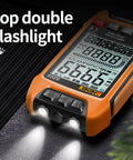 Versatile Digital Multimeter With Auto Ranging And TRMS 9999 Counts with double flashlight feature illuminated on table.
