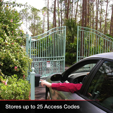 Person using Wireless Weatherproof Gate Keypad FM137 at a driveway gate, keypad supports 25 codes, visible in a lush forest setting
