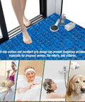 Person standing on blue 12 Piece Interlocking Drainage Mat Tiles For Garage, Deck, Pool And Outdoor Indoor Floors, Cushioned Non Slip PVC