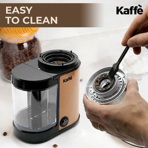 Premium Electric Flat Burr Coffee Grinder Featuring Adjustable Burrs And An Upgraded Quiet Motor For Legit Home Brewers 55 Ounce Copper Hopper being cleaned.