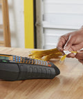 Straight Up Heavy Duty Jobsite Computer Connected Label Maker With Rechargeable Battery And Hard Case prints labeled cable on a wooden table.