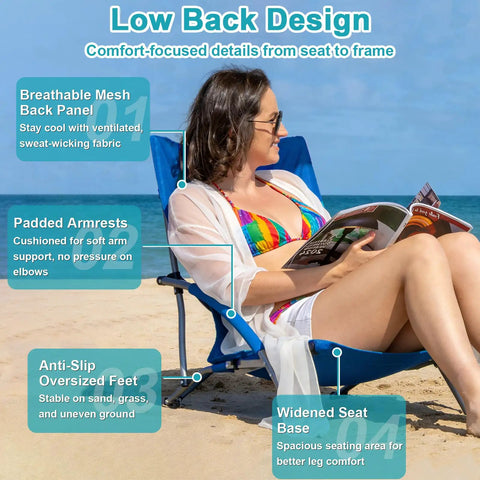 Woman sitting on 2 Pack Lightweight Low Beach Chairs With Breathable Mesh Back, Folding Portable Sand Chairs With Cup Holder, Ultralight 6 Lb Each, Heavy Duty 300 Lb Capacity, Easy Carry For Camping And Outdoor Use, Blue at the beach.