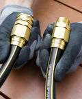 Hands holding Heavy Duty Garden Hose Repair Kit For Five Eighths Inch Hoses With Aluminum End Fittings Male And Female Connectors