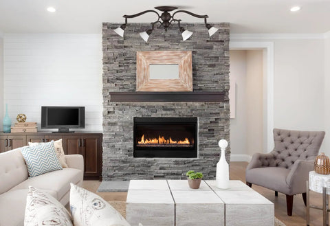 Living room with Addison 4-Light Dropped Track Lighting, flat opal glass shades, oil rubbed bronze finish, ceiling mounted.