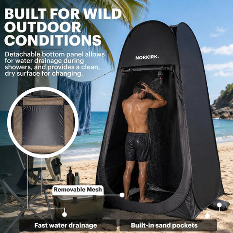 Person using Pop Up Privacy Tent With Mesh Floor For Quick Outdoor Shower on beach, showing removable mesh floor