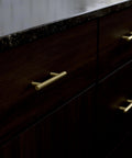 Satin Gold Cabinet Handles Set 30 Pack With Three Inch Center Holes Modern Pulls Installed on Dark Wood Cabinets