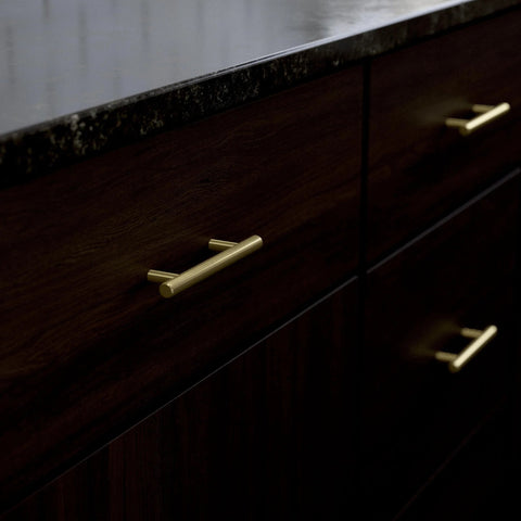 Satin Gold Cabinet Handles Set 30 Pack With Three Inch Center Holes Modern Pulls Installed on Dark Wood Cabinets