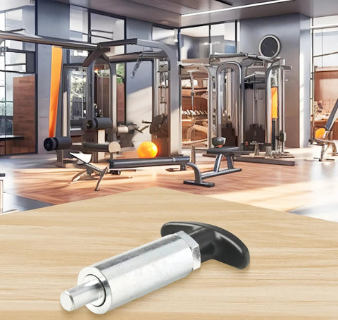 Heavy Duty Spring Loaded Pull Pin With Easy Grip Handle, Tough As Nails Steel Pop Pin Latch on wooden surface in gym setting.
