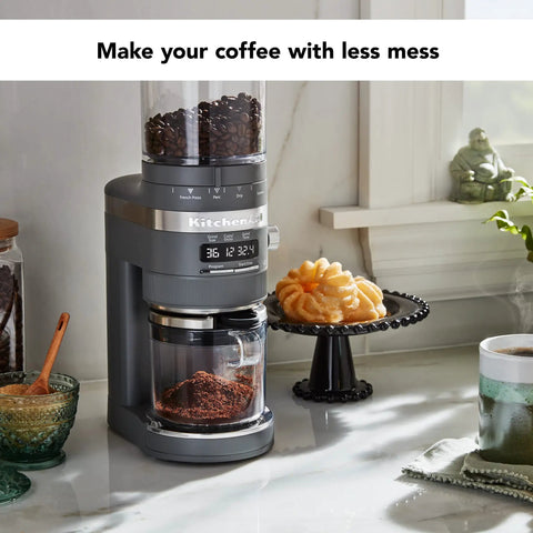 Premium Burr Coffee Grinder With Smart Dosing Technology For Dead Simple French Press To Espresso Ground Settings In Smooth Charcoal Grey Design near coffee and snacks.