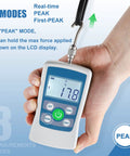 Digital Push Pull Force Gauge 500N With Real Time Peak And First Peak Modes Reads In N Lb Kg Oz With 0.1N Resolution Auto Shutoff 2 AAA Batteries Included Max Load 50Kg 110Lb 1800Oz Four Units Display For Precise Tension And Pull Tests. handheld force gauge showing peak mode LCD reading