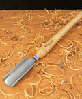 Heavy Duty High Speed Steel Spindle Roughing Gouge Set on wood shavings with a beech handle, ready for woodturning.