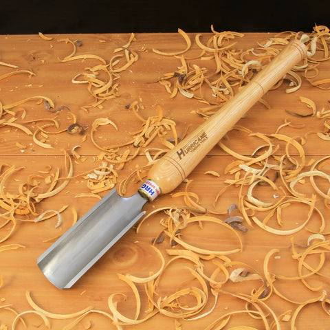 Heavy Duty High Speed Steel Spindle Roughing Gouge Set on wood shavings with a beech handle, ready for woodturning.