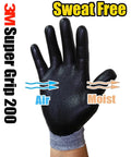 Close-up of a black nitrile foam coated glove demonstrating its air and moisture properties with '3M Super Grip 200' text.