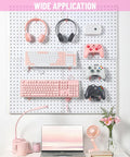 Pink Pegboard Hooks 2 Inch Set With Rubber Safety Tips used for organizing keyboards, headphones, and controllers on a pegboard