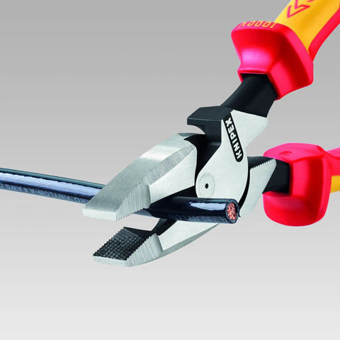 9.5 Inch Insulated Ultra-High Leverage Lineman's Pliers With Cable Puller, No-Sweat Setup, shown gripping a thick cable