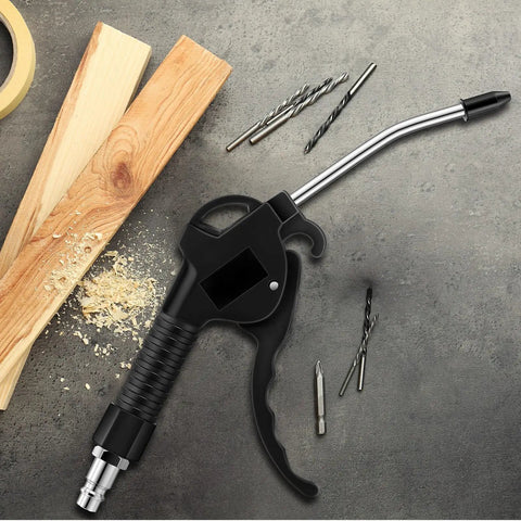 Heavy Duty 4 Piece Air Blow Gun Kit With Angled Aluminum Nozzles And Slick Pistol Grip To Blast Off Dust And Chips Fast For Auto Detailing Crew Or Local Shop on a workbench with wood and tools.