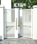 Built Tough 4 Pack Heavy Duty Satin Brass Hinges In Stainless Steel Four Inch Size Satin Gold Finish installed on outdoor gates