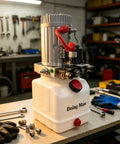 Doing Man Portable Hydraulic Power Unit With Plastic Oil Tank Industrial Pump Station with valve set and tools on workbench.