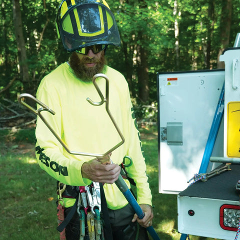 Arborist holding Rope Sniper Pro Arborist Tool For Effortless Rope Placement And Laser Sharp Precision On Challenging Jobs.