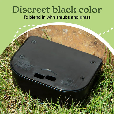 Heavy Duty Small Mouse Bait Stations With Secure Locks For Indoor Or Outdoor Pest Control And Discreet Rat And Mouse Bait Block Holders In A Practical 12 Pack Bundle To Kick Those Nasty Critters Out, black bait station in grass.