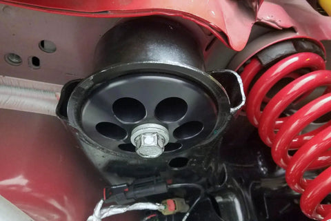 Beefy Aluminum Rear Cradle Bushing Kit For Hardcore Street Drift And Circuit Track Builds mounted with red coil spring.