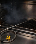 TL1915SL K-type thermocouple probe with 6-in thin tip and braided cable, yellow readout, installed in oven