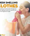 Woman enjoying fresh smelling clothes next to laundry basket in sunlight, promoting washer features for fragrance retention.