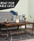 Black Steel Plumbing Pipe 3/4 Inch By 18 Inch Pre Cut 4 Pack used as table legs for industrial DIY furniture in living room.