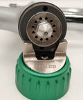 Close-up of Italian Designed HVLP Spray Gun With 1.3mm Tip And 600ml Cup Ergonomic Palm Fit Handle showing nozzle and green cap.
