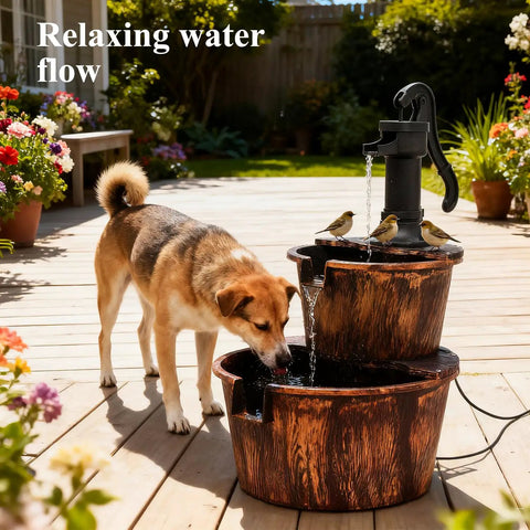 Dog drinking from Rustic Two Tier Barrel Waterfall Fountain For Backyard Patio And Garden Bronze Finish 27 Inch Electric Water Feature With Pump Included Freestanding Floor Or Tabletop Decor Durable Polypropylene Construction For Yard Oasis