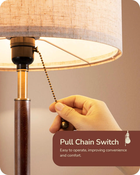 Hand using pull chain on Mid Century Table Lamp With Pull Chain Switch Solid Wood And Metal Pole Frosted Bronze Wood Finish Modern Nightstand Lamp