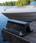 Heavy Duty Rubber Arch Bolt-Down Dock Protection for Marinas and Pontoon Docks secured on wooden dock with boat in background