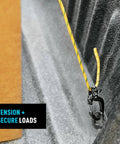 CamJam SlideLock Bungee Cord Tightener with Pull To Tighten Lock and Quick Release Lever securing a yellow cord on a truck bed