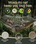 Heavy Duty Camping Hammock With Built-In Mosquito Net, 500 Lb Capacity, outdoor setup with couple and dog inside