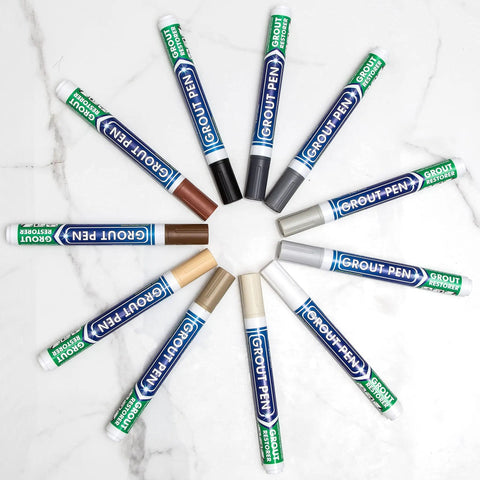 Easy Fix White Tile Grout Paint Marker Kit 5 Pack With Narrow 5mm Tips Waterproof Colorant And Sealer Pen arranged in a circle on marble surface