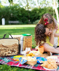 Insulated Lunch Bag With Desert Cactus And Cowboys Riding Horses Design on picnic blanket with food and family outdoors
