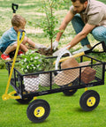 Heavy Duty Garden Cart With Removable Sides 1100 Pound Capacity Utility Wagon in yard with plants and gardening tools