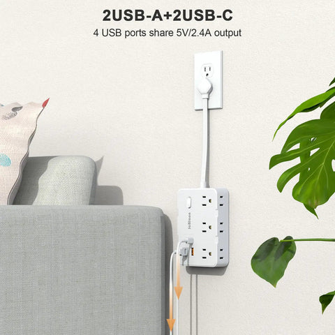 Game Changing Desktop Surge Protector Power Strip With Six AC Outlets And Four USB Charging Ports Low Profile Extension Cord on wall next to couch.