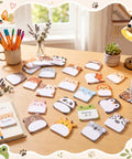 Dope 24 Pack Cartoon Animal Sticky Notes Set With 1152 Sheets arranged on desk with tea and decor