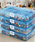 Blue 4 Pack Plastic Organizer Boxes With 40 Grids, Stackable Jewelry And Craft Storage Case filled with beads on a table