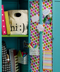 Polka dot decorated locker using Removable Poster Tape With Dispenser, Handy Three Quarters Inch Wide By 12.5 Feet Clear Double Sided Adhesive For Posters, Photos, Cards And More, Easy Detach On Most Surfaces Without Damage.