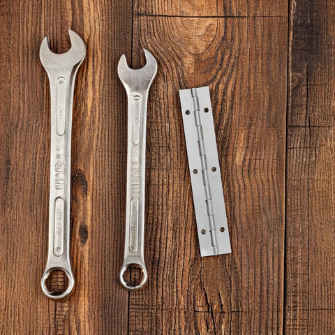 Heavy Duty Piano Hinge for Overlay Cabinet Doors and Furniture, Smooth pivot, alongside two wrenches on wooden surface